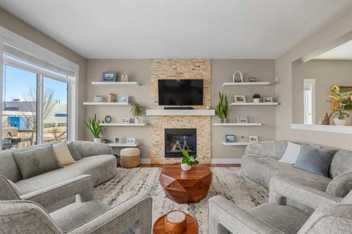 490 Mahogany Manor Se, Calgary, AB - Indoor Photo Showing Living Room With Fireplace
