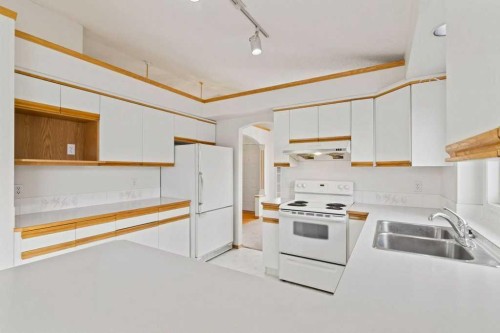179 Sunlake Way Se, Calgary, AB - Indoor Photo Showing Kitchen With Double Sink