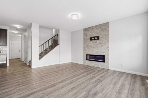 32 Red Embers Square Ne, Calgary, AB - Indoor Photo Showing Living Room With Fireplace