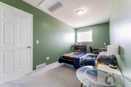31 Coventry Lane Ne, Calgary, AB - Indoor Photo Showing Bedroom