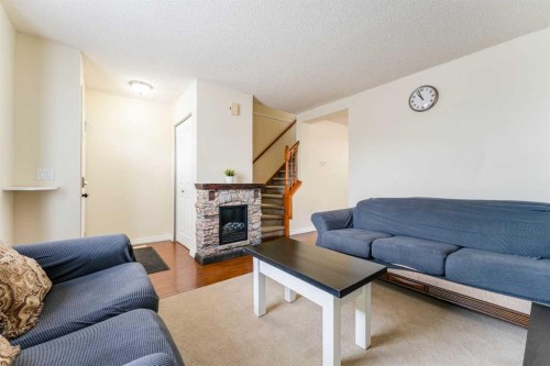 31 Coventry Lane Ne, Calgary, AB - Indoor Photo Showing Living Room With Fireplace