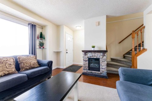 31 Coventry Lane Ne, Calgary, AB - Indoor Photo Showing Living Room With Fireplace