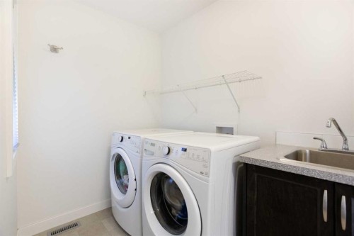 58 Nolancrest Rise Nw, Calgary, AB - Indoor Photo Showing Laundry Room