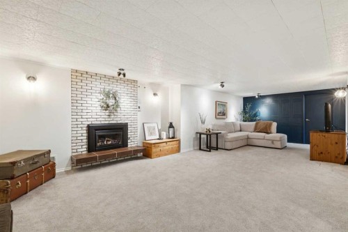 407 Arlington Drive Se, Calgary, AB - Indoor Photo Showing Living Room With Fireplace