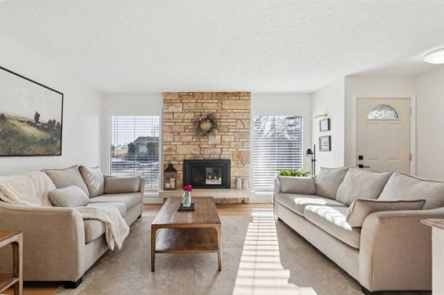 407 Arlington Drive Se, Calgary, AB - Indoor Photo Showing Living Room With Fireplace