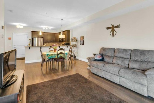 2104-15 Sunset Square, Cochrane, AB - Indoor Photo Showing Living Room