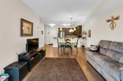 2104-15 Sunset Square, Cochrane, AB - Indoor Photo Showing Living Room