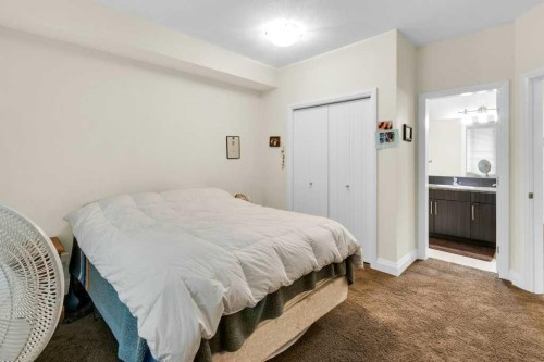 2104-15 Sunset Square, Cochrane, AB - Indoor Photo Showing Bedroom