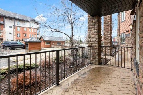 2104-15 Sunset Square, Cochrane, AB - Outdoor With Balcony With Exterior