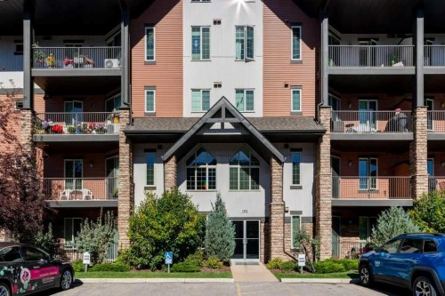 2104-15 Sunset Square, Cochrane, AB - Outdoor With Balcony With Facade