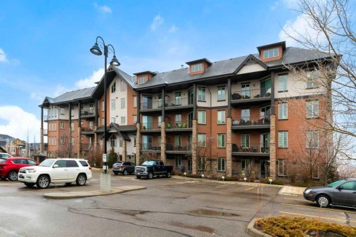 2104-15 Sunset Square, Cochrane, AB - Outdoor With Balcony With Facade