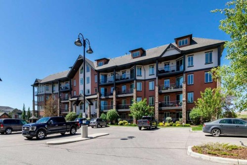 2104-15 Sunset Square, Cochrane, AB - Outdoor With Balcony With Facade