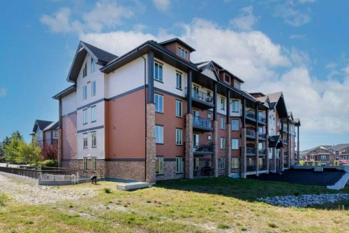 2104-15 Sunset Square, Cochrane, AB - Outdoor With Facade