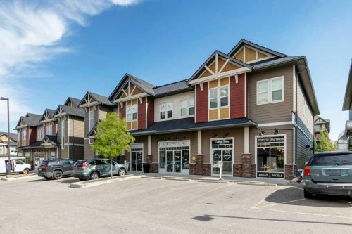 2104-15 Sunset Square, Cochrane, AB - Outdoor With Facade