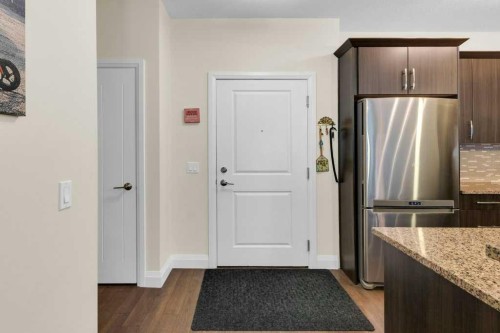 2104-15 Sunset Square, Cochrane, AB - Indoor Photo Showing Kitchen