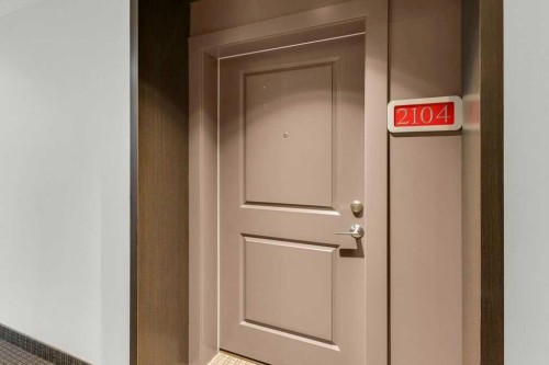 2104-15 Sunset Square, Cochrane, AB - Indoor Photo Showing Other Room