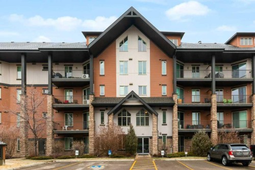 2104-15 Sunset Square, Cochrane, AB - Outdoor With Balcony With Facade