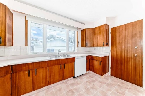 5116 33 Street Nw, Calgary, AB - Indoor Photo Showing Kitchen With Double Sink