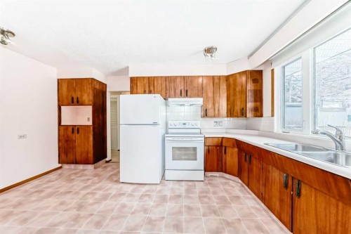 5116 33 Street Nw, Calgary, AB - Indoor Photo Showing Kitchen With Double Sink