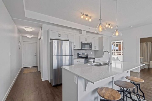 404-10 Walgrove Se, Calgary, AB - Indoor Photo Showing Kitchen With Stainless Steel Kitchen With Double Sink With Upgraded Kitchen