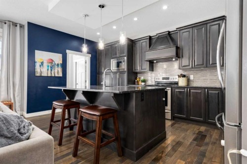 306 Cooperstown Common Sw, Airdrie, AB - Indoor Photo Showing Kitchen With Upgraded Kitchen