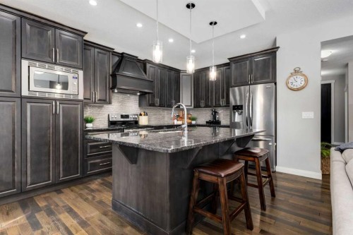 306 Cooperstown Common Sw, Airdrie, AB - Indoor Photo Showing Kitchen With Upgraded Kitchen