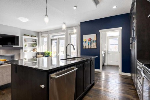 306 Cooperstown Common Sw, Airdrie, AB - Indoor Photo Showing Kitchen With Double Sink With Upgraded Kitchen