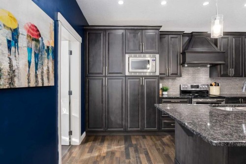 306 Cooperstown Common Sw, Airdrie, AB - Indoor Photo Showing Kitchen With Upgraded Kitchen