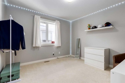 306 Cooperstown Common Sw, Airdrie, AB - Indoor Photo Showing Other Room