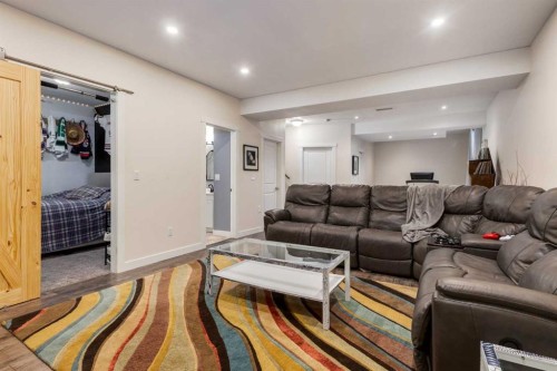 306 Cooperstown Common Sw, Airdrie, AB - Indoor Photo Showing Living Room