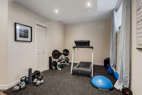 306 Cooperstown Common Sw, Airdrie, AB - Indoor Photo Showing Gym Room