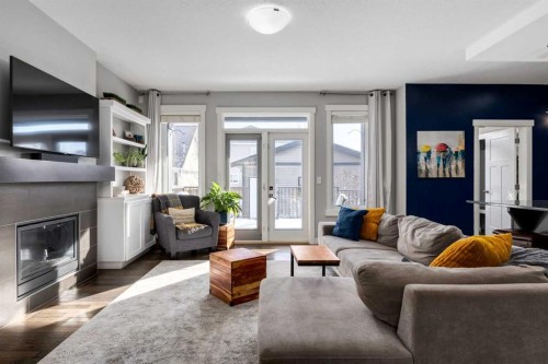 306 Cooperstown Common Sw, Airdrie, AB - Indoor Photo Showing Living Room With Fireplace