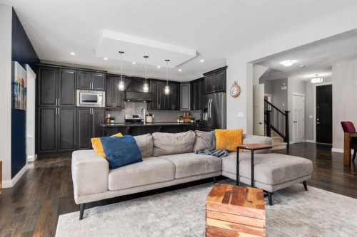 306 Cooperstown Common Sw, Airdrie, AB - Indoor Photo Showing Living Room