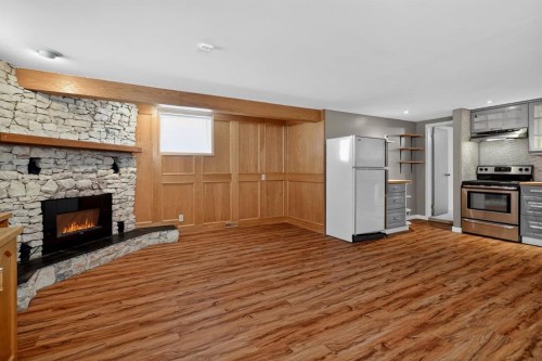 48 Carnarvon Way Nw, Calgary, AB - Indoor With Fireplace