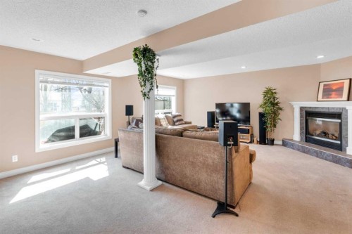 135 Citadel Estates Place Nw, Calgary, AB - Indoor Photo Showing Living Room With Fireplace