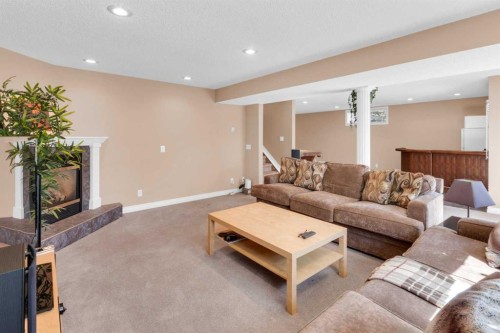 135 Citadel Estates Place Nw, Calgary, AB - Indoor Photo Showing Living Room With Fireplace