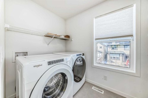 64 Masters Row Se, Calgary, AB - Indoor Photo Showing Laundry Room