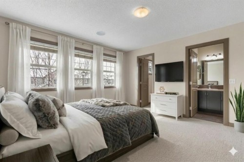 106 Luxstone Way Sw, Airdrie, AB - Indoor Photo Showing Bedroom