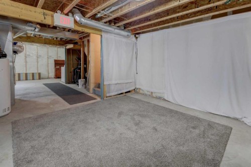 106 Luxstone Way Sw, Airdrie, AB - Indoor Photo Showing Basement