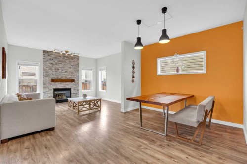 19 Bridleridge Green Sw, Calgary, AB - Indoor Photo Showing Living Room With Fireplace