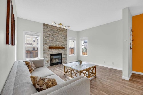 19 Bridleridge Green Sw, Calgary, AB - Indoor Photo Showing Living Room With Fireplace