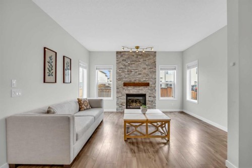 19 Bridleridge Green Sw, Calgary, AB - Indoor Photo Showing Living Room With Fireplace