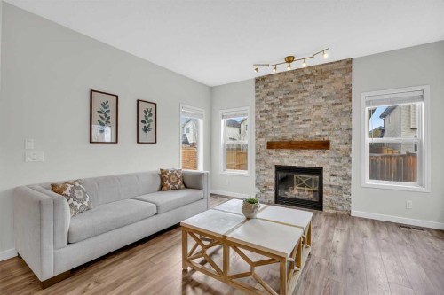 19 Bridleridge Green Sw, Calgary, AB - Indoor Photo Showing Living Room With Fireplace