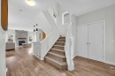 19 Bridleridge Green Sw, Calgary, AB  - Indoor Photo Showing Other Room With Fireplace 