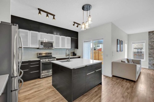 19 Bridleridge Green Sw, Calgary, AB - Indoor Photo Showing Kitchen With Stainless Steel Kitchen With Double Sink With Upgraded Kitchen
