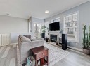 104 Prestwick Gardens Se, Calgary, AB  - Indoor Photo Showing Living Room With Fireplace 