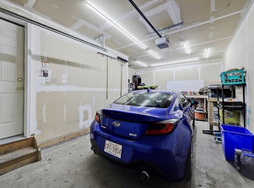 104 Prestwick Gardens Se, Calgary, AB - Indoor Photo Showing Garage
