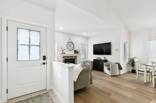 852 Everridge Drive Sw, Calgary, AB - Indoor Photo Showing Living Room With Fireplace