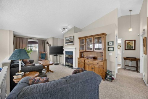 466 Douglas Glen Boulevard Se, Calgary, AB - Indoor Photo Showing Living Room With Fireplace