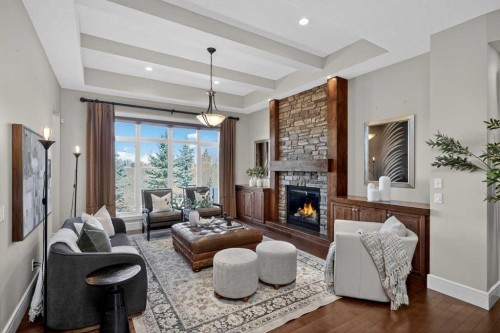 125 Artesia Gate, Heritage Pointe, AB - Indoor Photo Showing Living Room With Fireplace